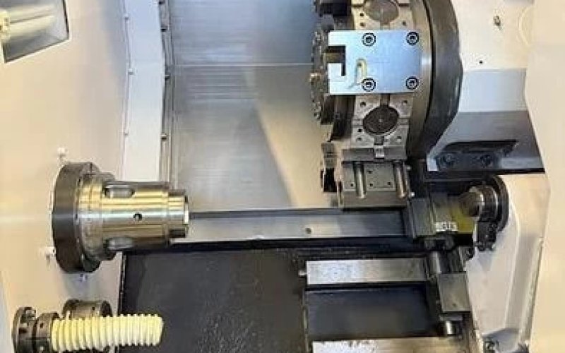 Токарний верстат з ЧПУ Hwacheon CUTEX 160 б/в з пристроєм подачі прутка
