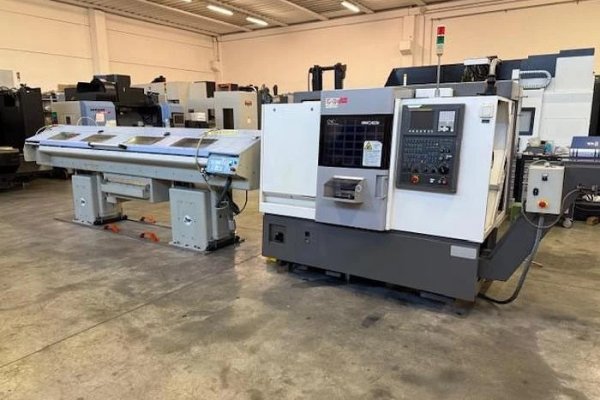 Токарний верстат з ЧПУ Hwacheon CUTEX 160 б/в з пристроєм подачі прутка